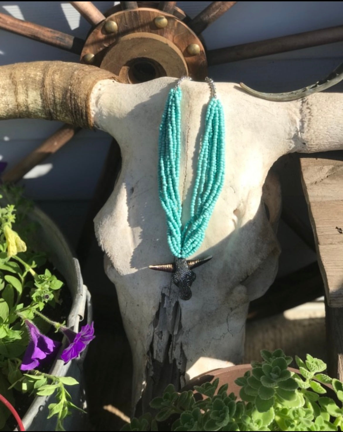 Turquoise necklace with sparkly cowhead 